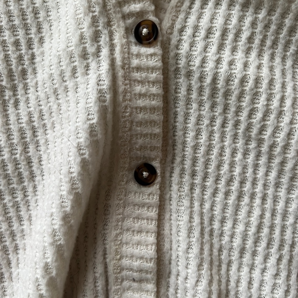 Long sleeve white sweater shirt.